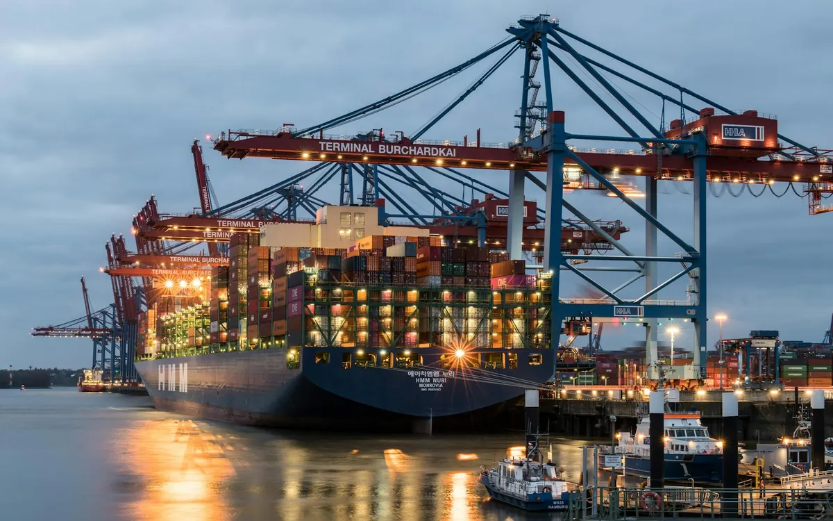 Container ship arriving at Hamburg destination port for handover